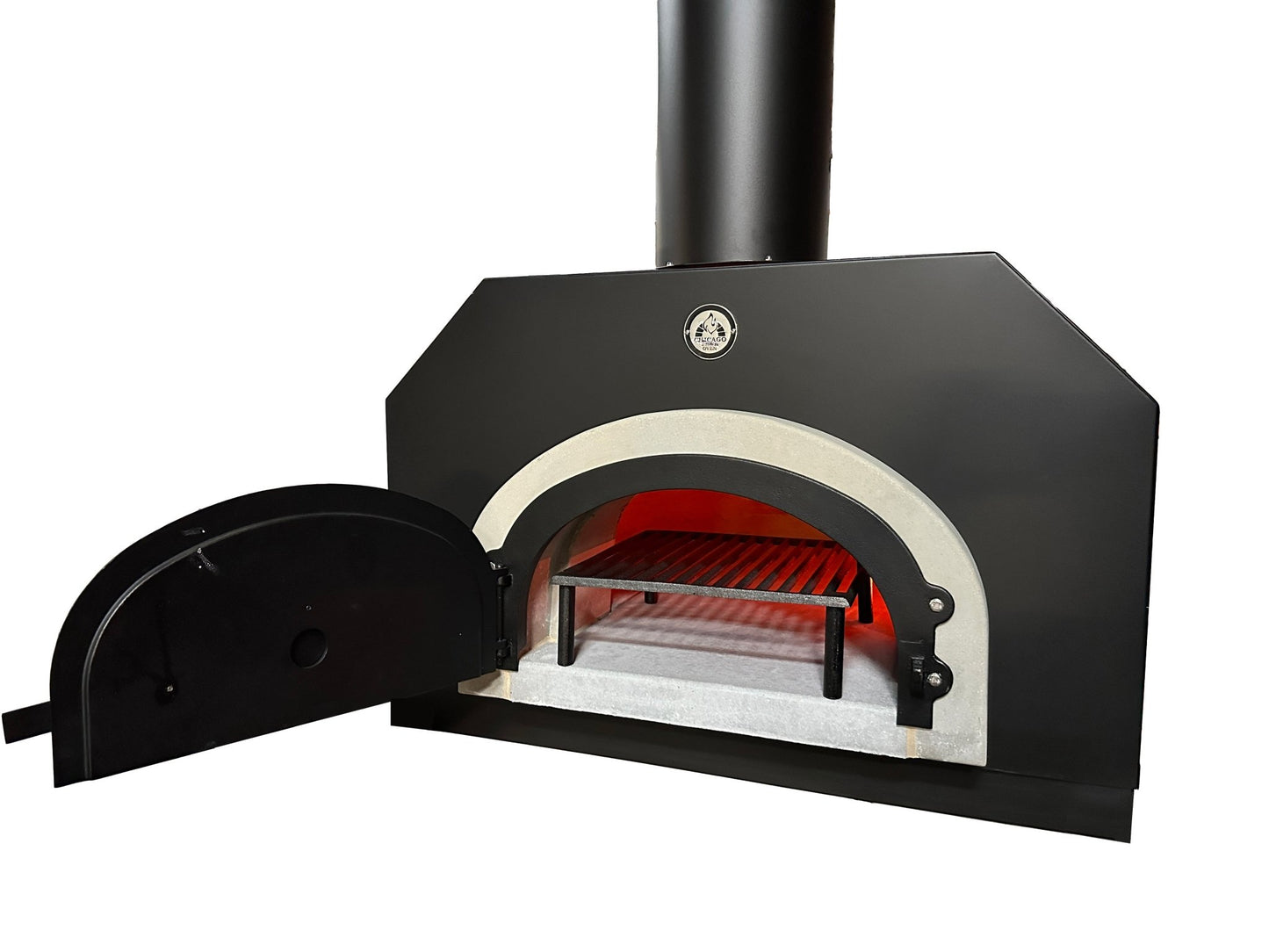 A black outdoor wood-fired pizza oven with an open door reveals a blazing fire inside. The curved front and chimney top add to its rustic charm. Lined with heat-resistant material and featuring a temperature gauge, it sits perfectly alongside the Chicago Brick Oven Tuscan Cast Iron Grill for the ultimate cooking experience.