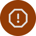 A brown circular icon with a white octagon containing an exclamation mark in the center, symbolizing an alert or warning.
