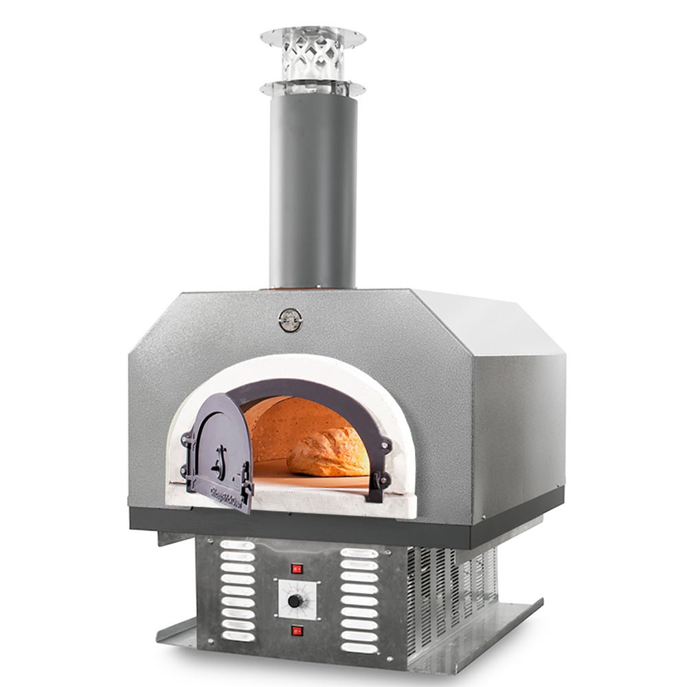 The Chicago Brick Oven CBO 750 Hybrid Countertop (Residential) No SKIRT offers a sleek, modern design with a stainless steel finish. Featuring a cylindrical chimney, curved front opening, and visible interior fire, this high-performance dual fuel (gas and wood) oven boasts a rectangular body elevated on a metal stand complete with vent and control buttons. Experience the signature FlameRoll for perfect pizzas every time.