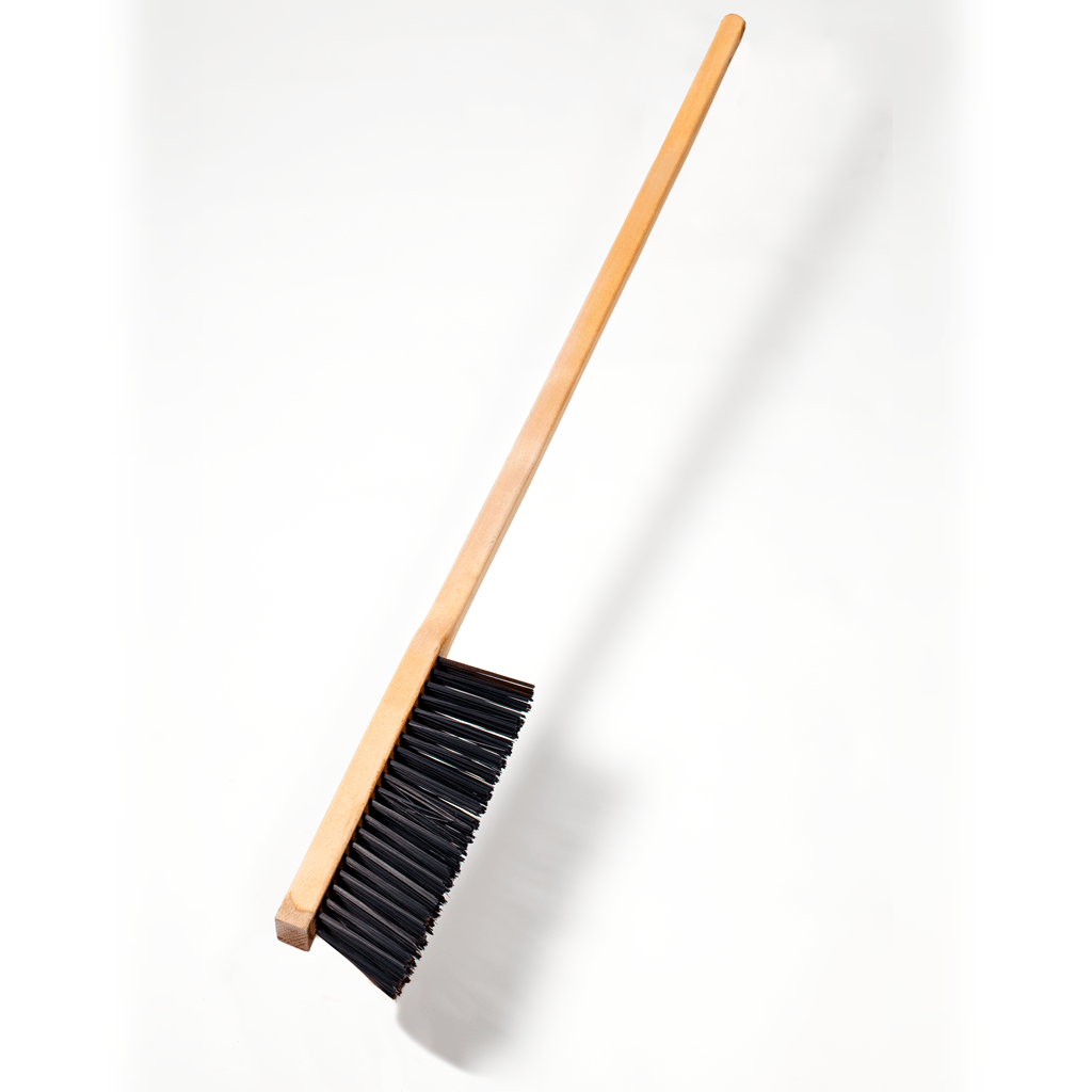 A Chicago Brick Oven Wire Brush with a 39" handle, positioned diagonally against a plain white background. The long, straight handle and dense black bristles are prominently visible.