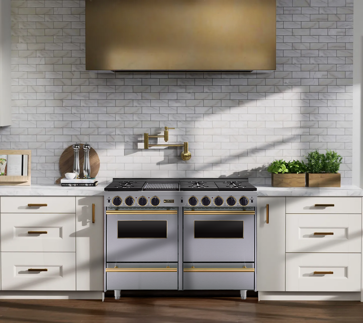 48-inch all-gas sealed-burner range in stainless steel with brass trim in a white kitchen.