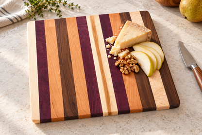 cbo newport multi wood cutting board — AI-generated in-use concept; Default wood design; no custom engraving depicted