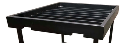 A black, rectangular Chicago Brick Oven CBO-1000 Countertop Box/Tray with evenly spaced, parallel slats sits atop a welded steel frame. The tray, likely designed for supporting or holding items often used in industrial or workshop settings, is showcased against a plain white background.