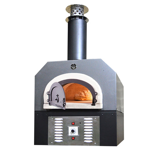 The Chicago Brick Oven CBO 750 Hybrid Countertop (Residential) | Dual Fuel (Gas and Wood) is a high-performance outdoor pizza oven with a sleek black chimney and an elegant grey and white exterior. The partially open oven door reveals a delicious pizza baking inside, while the front boasts a sophisticated metal panel equipped with control knobs and indicator lights, making it one of the finest pizza ovens on the market.