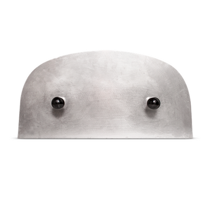 The CBO-750 Insulating Door by Chicago Brick Oven is a sleek, curved metallic oven accessory featuring two black spherical knobs symmetrically positioned on the lower half. Placed against a plain white background, its brushed finish offers a slightly textured surface that is perfect for heat retention and low-temperature cooking.