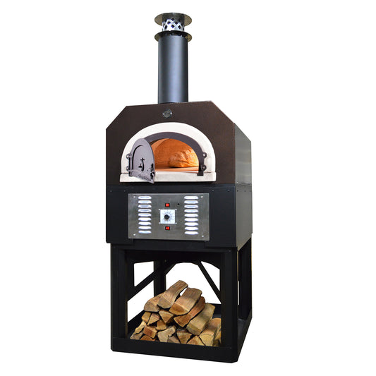 A Chicago Brick Oven CBO 750 Hybrid Stand (Residential) in black, designed for dual fuel usage with gas and wood, features a freestanding outdoor design with a metal body, chimney, and front door revealing a loaf of bread baking inside. Engineered for high-performance cooking, this oven sits on a sturdy frame with a storage area below, neatly stocked with wood logs.