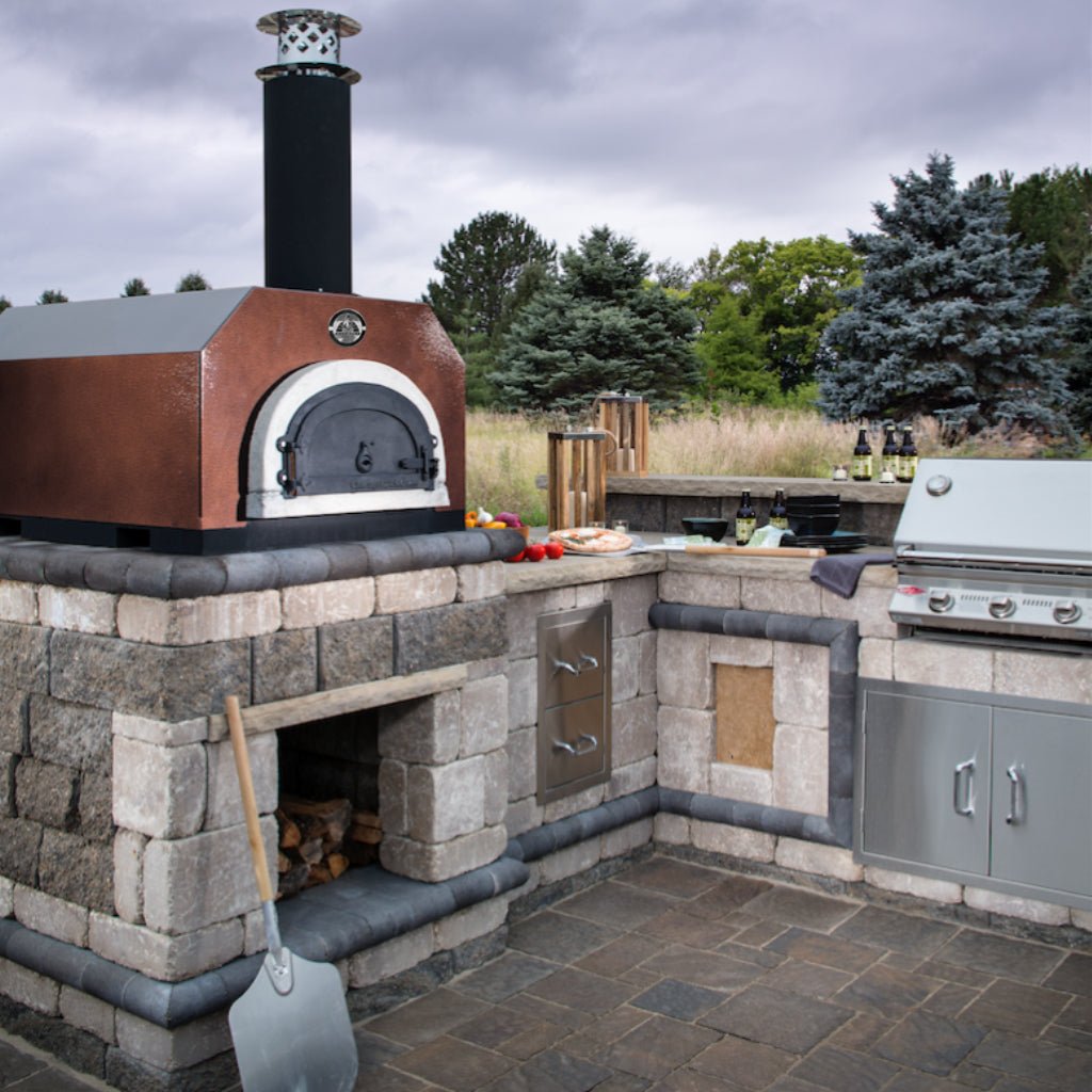 Copper Vein CBO 750 Countertop oven in a stone outdoor kitchen