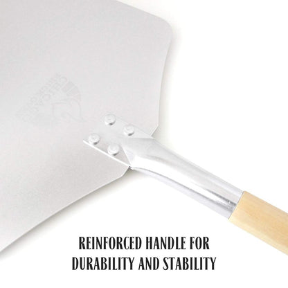 Close-up of a Chicago Brick Oven Pizza Peel featuring a 12" x 14" aluminum blade and a detachable 21" wooden handle. The reinforced metal construction ensures durability and stability, similar to an industrial-grade shovel. The text "REINFORCED HANDLE FOR DURABILITY AND STABILITY" appears at the bottom, highlighting its rugged design reminiscent of an aluminum pizza paddle built for heavy use.