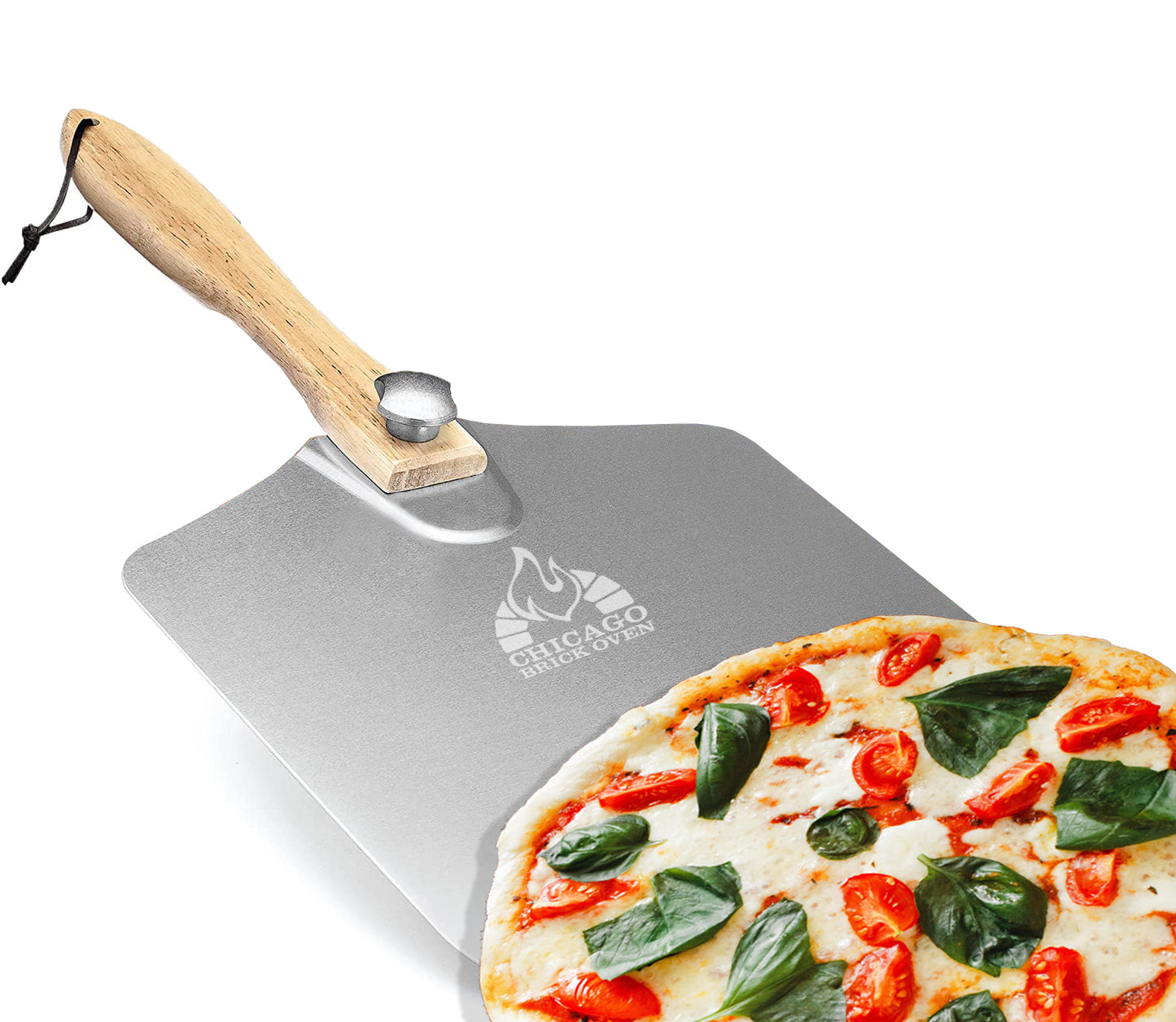 The Chicago Brick Oven Aluminum Pizza Peel 12" x 14" with a foldable wooden handle is lifting a freshly baked pizza topped with tomatoes, basil, and mozzarella cheese. The aluminum metal blade features the "Chicago Brick Oven" logo etched near the handle.