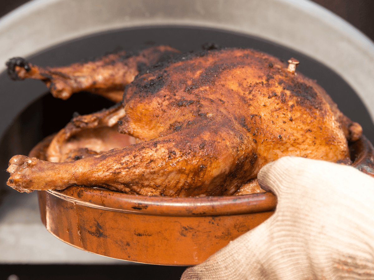 A roast turkey prepared in a wood-fired oven